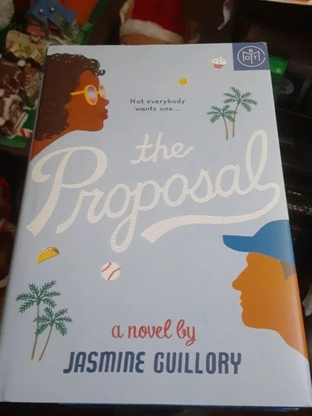 The Proposal by Jasmine Guillory - Light Blue Hardcover Coffee Table Book